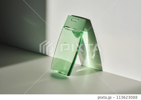 Shower gel or shampoo on a white background with sun light. 113623088