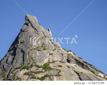 Moon over the sharp rock. Moon over the sharp rock. 113623599
