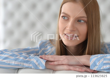 Beauty portrait. Young woman on grey wall background. 113623825