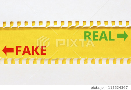 Real or fake symbol. Concept word Real or Fake on beautiful yellow paper. Beautiful white paper background. Business and real or fake concept. Copy space. 113624367