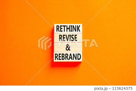Rethink revise rebrand symbol. Concept word Rethink Revise and Rebrand on beautiful block. Beautiful orange background. Business brand motivational rethink revise rebrand concept. Copy space. 113624375