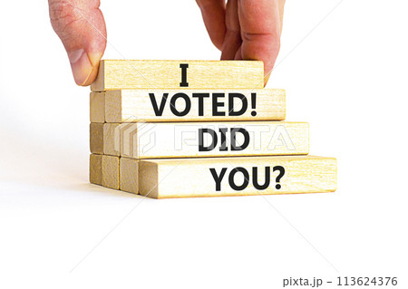 I voted. Did you symbol. Concept words I voted. Did you on beautiful wooden block. Beautiful white table white background. Voter hand. Business I voted. Did you concept. Copy space. 113624376