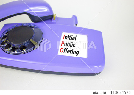 IPO initial public offering symbol. Concept words IPO initial public offering on beautiful old disk phone. Beautiful white background. Business IPO initial public offering concept. Copy space. IPO initial public offering symbol. Concept words IPO initial public offering on beautiful old disk phone. Beautiful white background. Business IPO initial public offering concept. Copy space. 113624570