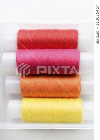 Multicolored skeins of thread in the set. The threads are in a plastic box. Multicolored skeins of thread in the set. The threads are in a plastic box. 113625467