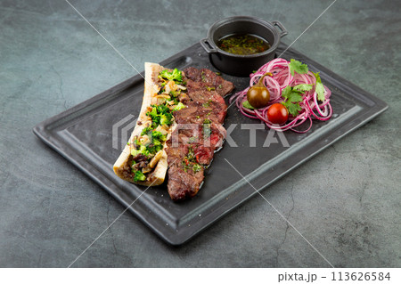 lamb ribs with cauliflower onions, broccoli and soy sauce, side view lamb ribs with cauliflower onions, broccoli and soy sauce, side view 113626584