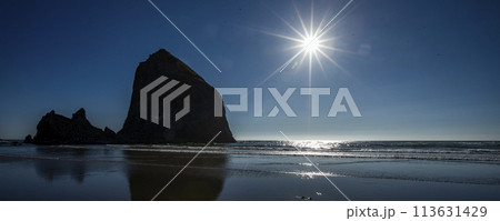 USA, Oregon, Silhouette of Haystack Rock at Cannon Beach 113631429