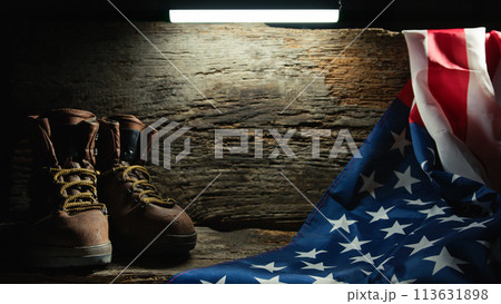 Military belongings leaved near a USA flag on Memorial Day Military belongings leaved near a USA flag on Memorial Day 113631898