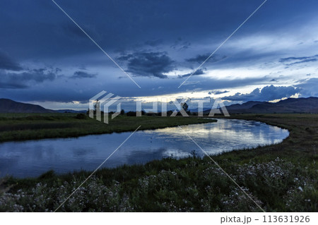 Reflection of evening storm in Silver Creek 113631926