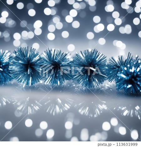 Christmas background with blue tinsel on bokeh defocused lights Christmas background with blue tinsel on bokeh defocused lights 113631999