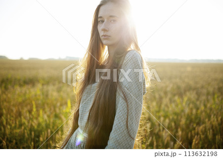 Beautiful woman posing in rural area 113632198