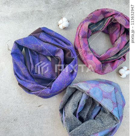 Colorful scarf on cement background. Top view. Flat lay. Colorful scarf on cement background. Top view. Flat lay. 113632947