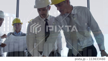 Architects discuss a building plan with graphs 113633480