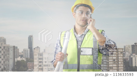 Image of cityscape over caucasian male worker 113633593