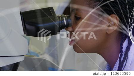 Image of dna strand over diverse doctors using microscope Image of dna strand over diverse doctors using microscope 113633596