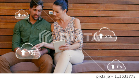 Image of digital interface with cloud icons with numbers growing and data processing over couple usi Image of digital interface with cloud icons with numbers growing and data processing over couple usi 113633775