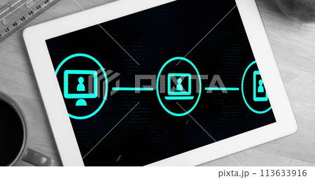 Image of digital interface with icons over screen of digital tablet on desk 113633916