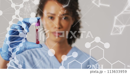 Image of dna strand and shapes over biracial female doctor with test tube Image of dna strand and shapes over biracial female doctor with test tube 113633959