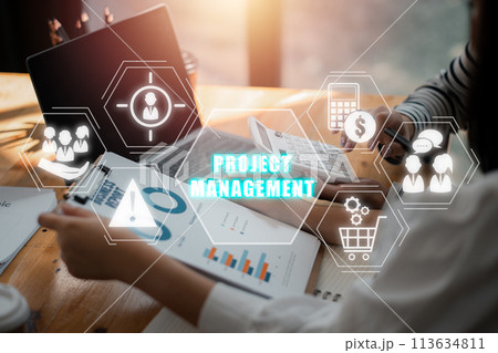Project management concept, Business team analyzing income charts and graphs on office desk with human resources, risk, scope, cost, procurement and communication icon on virtual screen. Project management concept, Business team analyzing income charts and graphs on office desk with human resources, risk, scope, cost, procurement and communication icon on virtual screen. 113634811