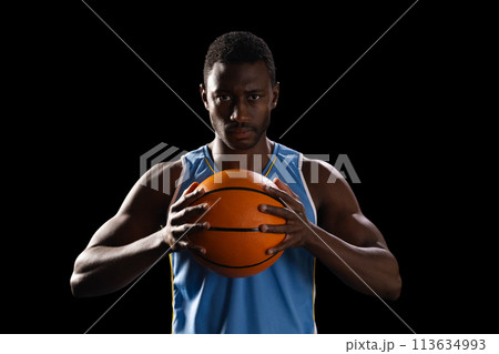 African American man holds a basketball, with copy space African American man holds a basketball, with copy space 113634993