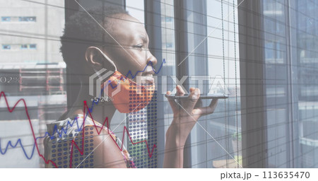 Image of financial data processing over businesswoman with face mask using smartphone in office Image of financial data processing over businesswoman with face mask using smartphone in office 113635470