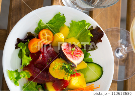 Salad with fresh tuna, mango, zucchini Salad with fresh tuna, mango, zucchini 113638680