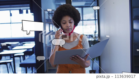Image of speech bubbles over african american businesswoman talking on smartphone Image of speech bubbles over african american businesswoman talking on smartphone 113639017