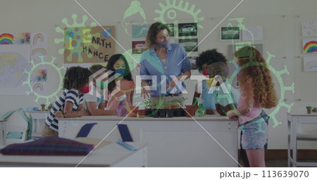 Digital composition of covid-19 concept icons floating against female teacher and students in biolog Digital composition of covid-19 concept icons floating against female teacher and students in biolog 113639070
