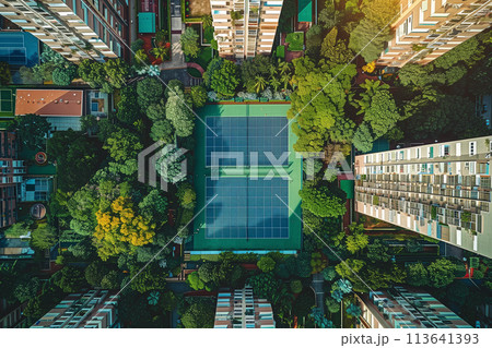 Aerial View of Tennis Court Surrounded by Buildings Aerial View of Tennis Court Surrounded by Buildings 113641393