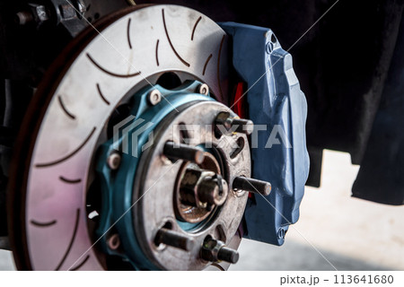 Checking car brake system for repair at car garage Checking car brake system for repair at car garage 113641680