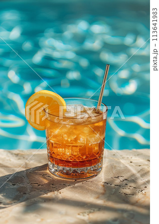 Cocktail glasses at pool, beach side 113641983