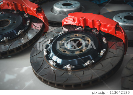Checking car brake system for repair at car garage Checking car brake system for repair at car garage 113642189
