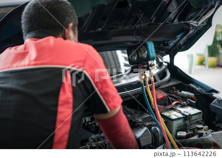 Car refilling air condition at car garage Car refilling air condition at car garage 113642226