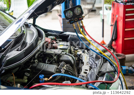Car refilling air condition at car garage Car refilling air condition at car garage 113642292