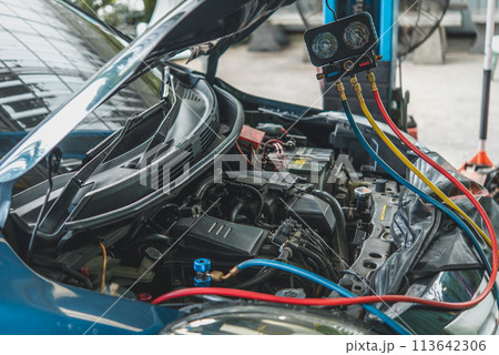 Car refilling air condition at car garage Car refilling air condition at car garage 113642306