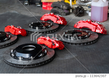 Checking car brake system for repair at car garage 113642307