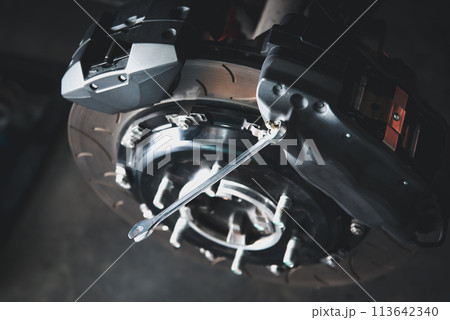 Checking car brake system for repair at car garage Checking car brake system for repair at car garage 113642340