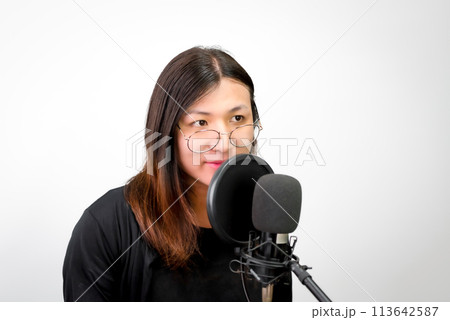Woman (LGBTQ) singer sing a song with microphone Woman (LGBTQ) singer sing a song with microphone 113642587