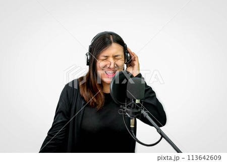 Woman (LGBTQ) singer sing a song with microphone 113642609