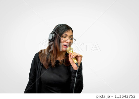 Woman (LGBTQ) singer sing a song with microphone Woman (LGBTQ) singer sing a song with microphone 113642752