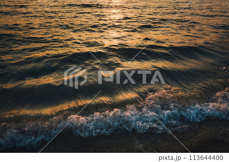 Sunset at Railay Beach with orange lights 113644400