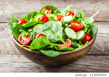 Fresh Spinach Salad with Cherry Tomatoes and Cucumber 113644838
