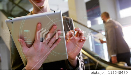 Young Caucasian woman interacts with a futuristic interface, with copy space Young Caucasian woman interacts with a futuristic interface, with copy space 113648489