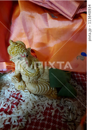 Puja of Reclining Ganesha Idol 113648934