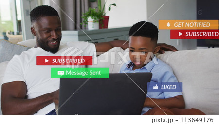 Image of subscribe over happy african american father and son using laptop 113649176