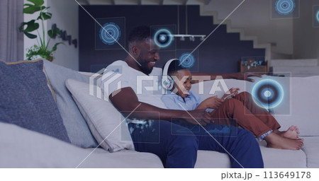 Image of diverse data over happy african american father and son using tablet 113649178