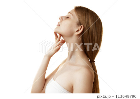 Side view photo of young woman massaging her neck and chin to prevent double chin against white studio background. 113649790
