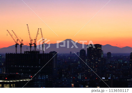 Sunset behind Mt. Fuji as seen from Minato-ku in central Tokyo Japan Sunset behind Mt. Fuji as seen from Minato-ku in central Tokyo Japan 113650117