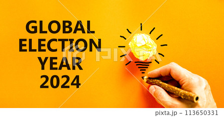 Global election year 2024 symbol. Concept words Global election year 2024 on beautiful orange paper. Beautiful orange background. Voter hand. Business Global election year 2024 concept. Copy space Global election year 2024 symbol. Concept words Global election year 2024 on beautiful orange paper. Beautiful orange background. Voter hand. Business Global election year 2024 concept. Copy space 113650331