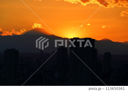 Sunset behind Mt. Fuji as seen from Minato-ku in central Tokyo Japan Sunset behind Mt. Fuji as seen from Minato-ku in central Tokyo Japan 113650361