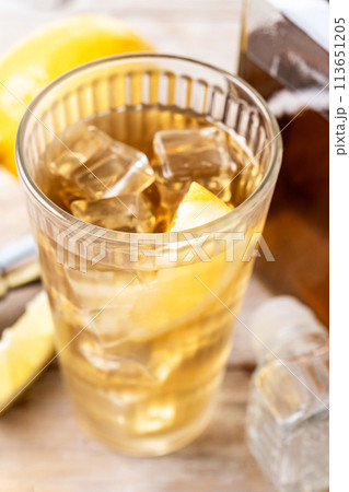 Highball, Whiskey with soda and lemon beverage on wooden table Highball, Whiskey with soda and lemon beverage on wooden table 113651205